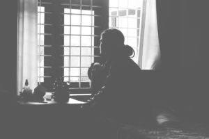 person looking out the window